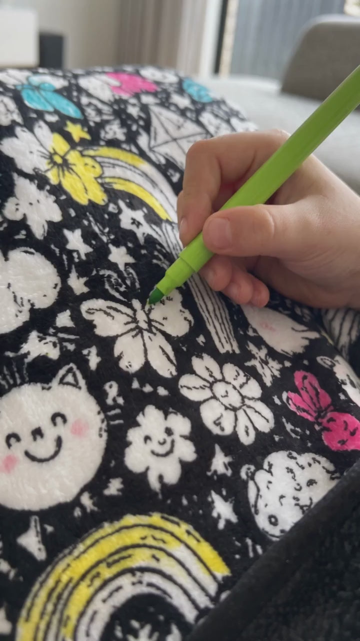 Illustrative AI scene: a close-up hand coloring a butterfly on a Scriblo blanket.